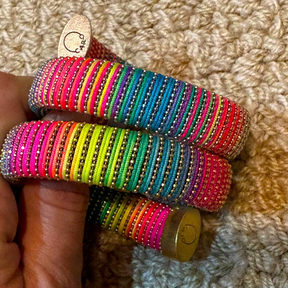 Carolina bucci caro lurex cuff in tye dye never worn. One is gold and one silver
